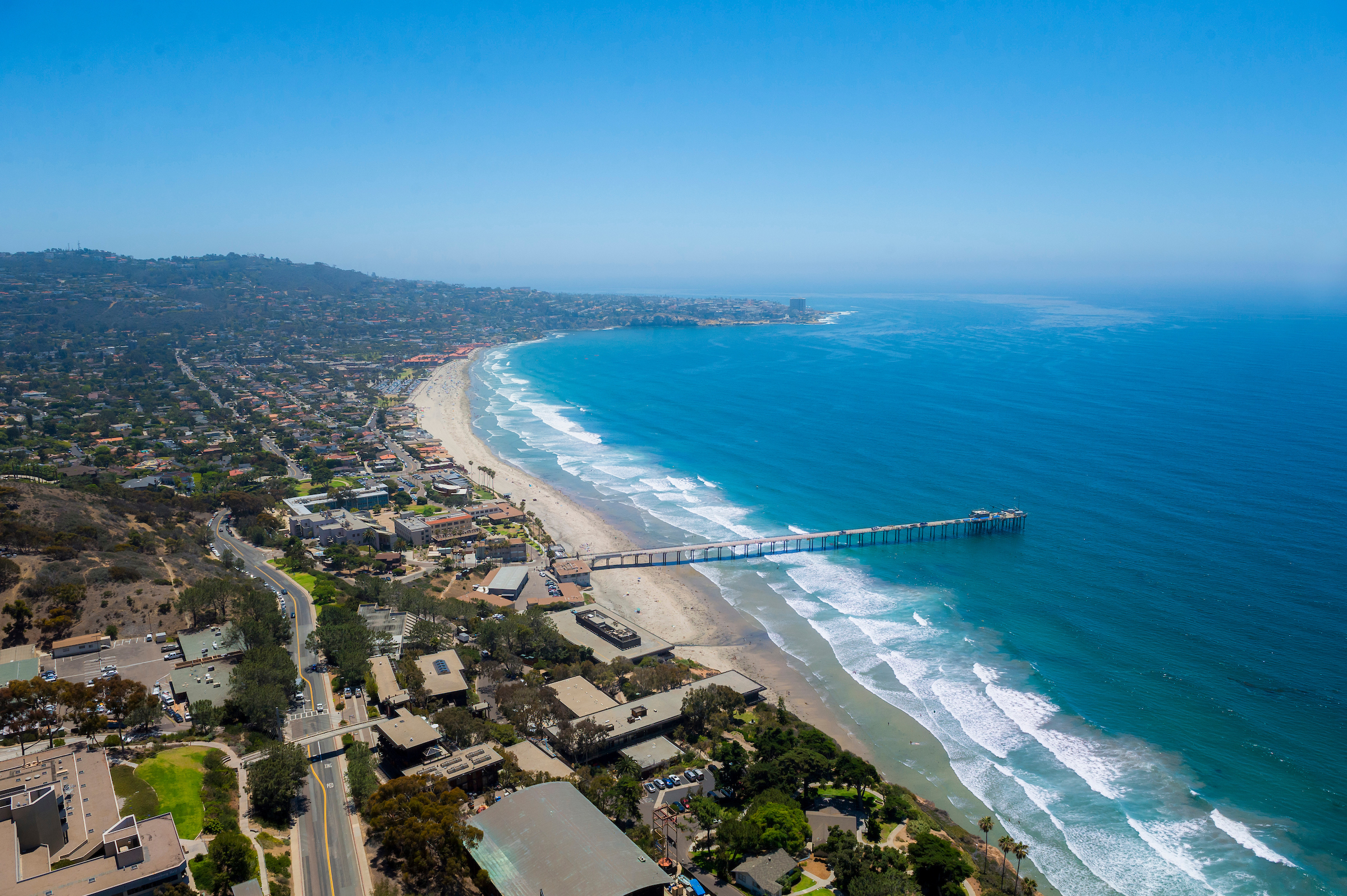 Aerial view of UC San Diego with Scripps Pier by the ocean